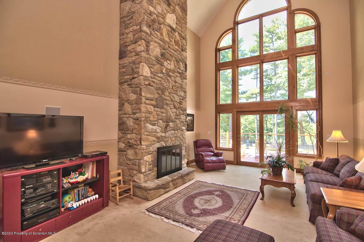 353 Ridge Road Wyoming, PA 18644 - Photo 17 of 157 a living room with fireplace furniture and a flat screen tv