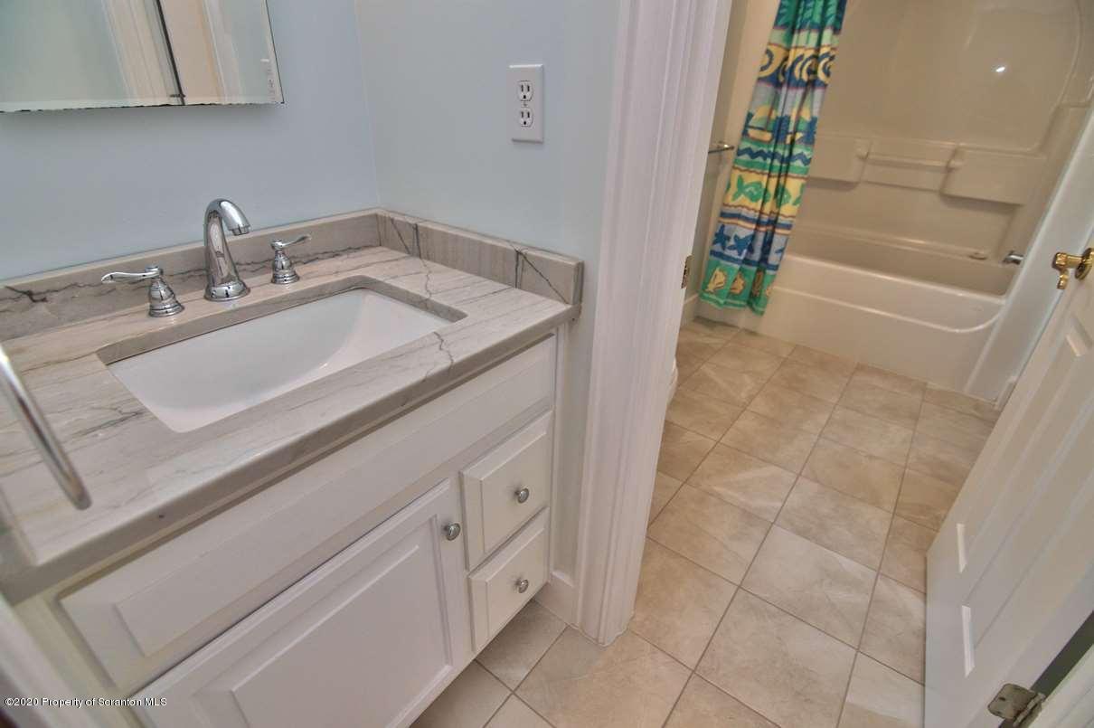 353 Ridge Road Wyoming, PA 18644 - Photo 50 of 157 a bathroom with a sink and a mirror