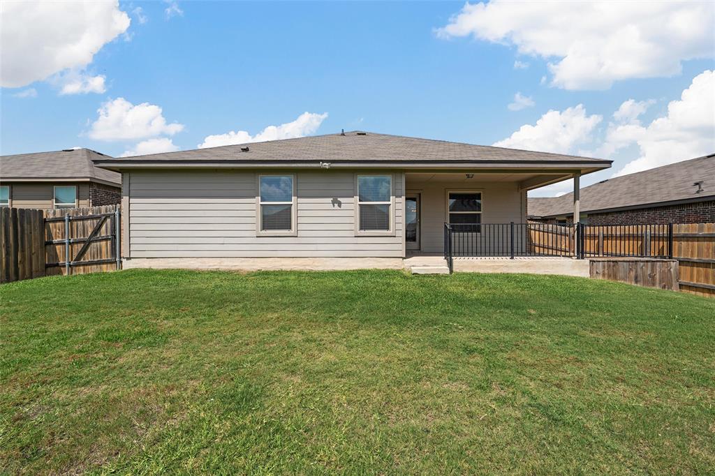 3217 Beutel Road Lorena, TX 76655 - Photo 32 of 40 Back of property featuring a patio area and a fenced backyard