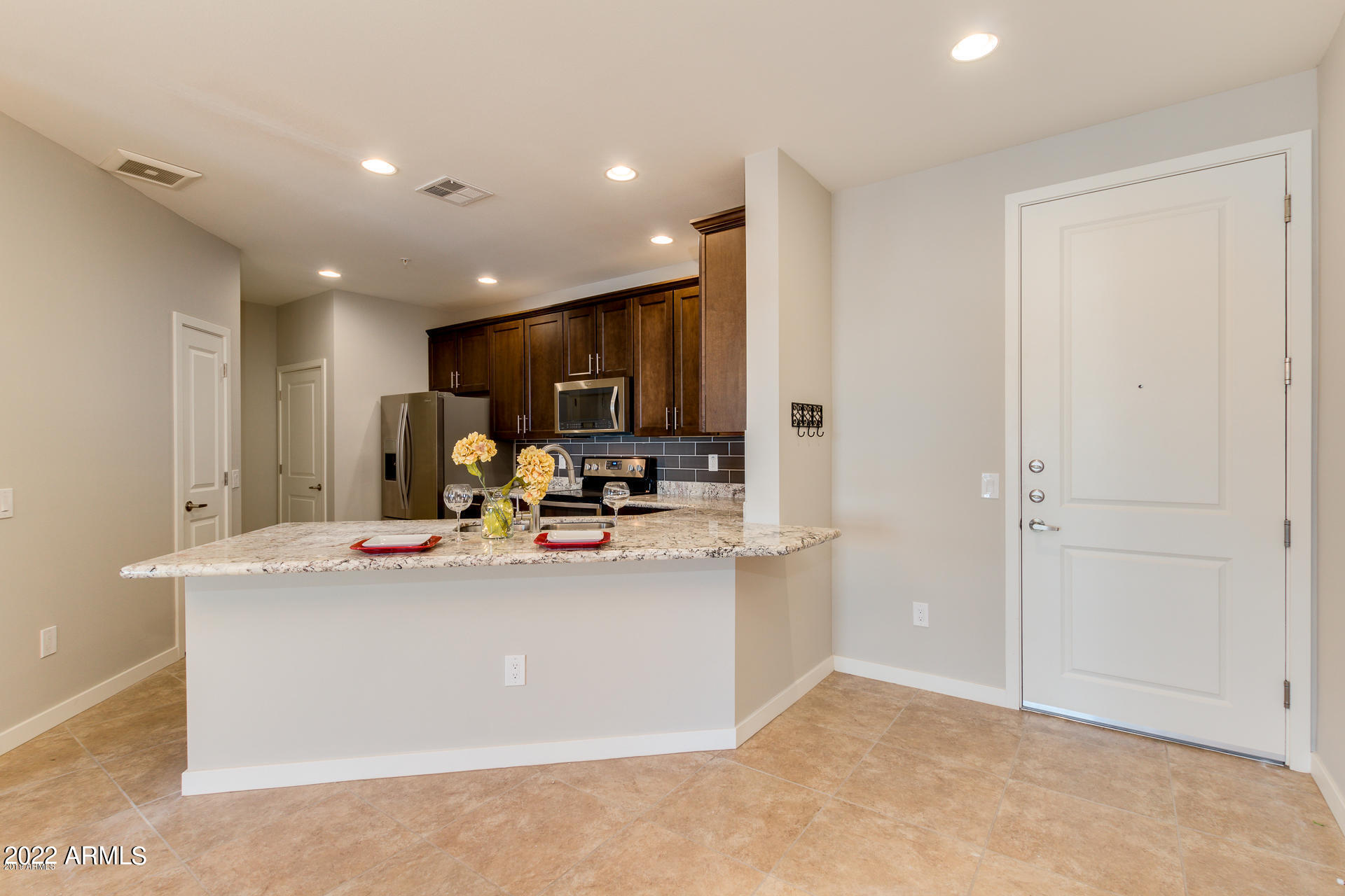 2511 West Queen Creek Road, Unit 238 Chandler, AZ 85248 - Photo 14 of 22 a view of kitchen with stainless steel appliances granite countertop refrigerator sink and stove