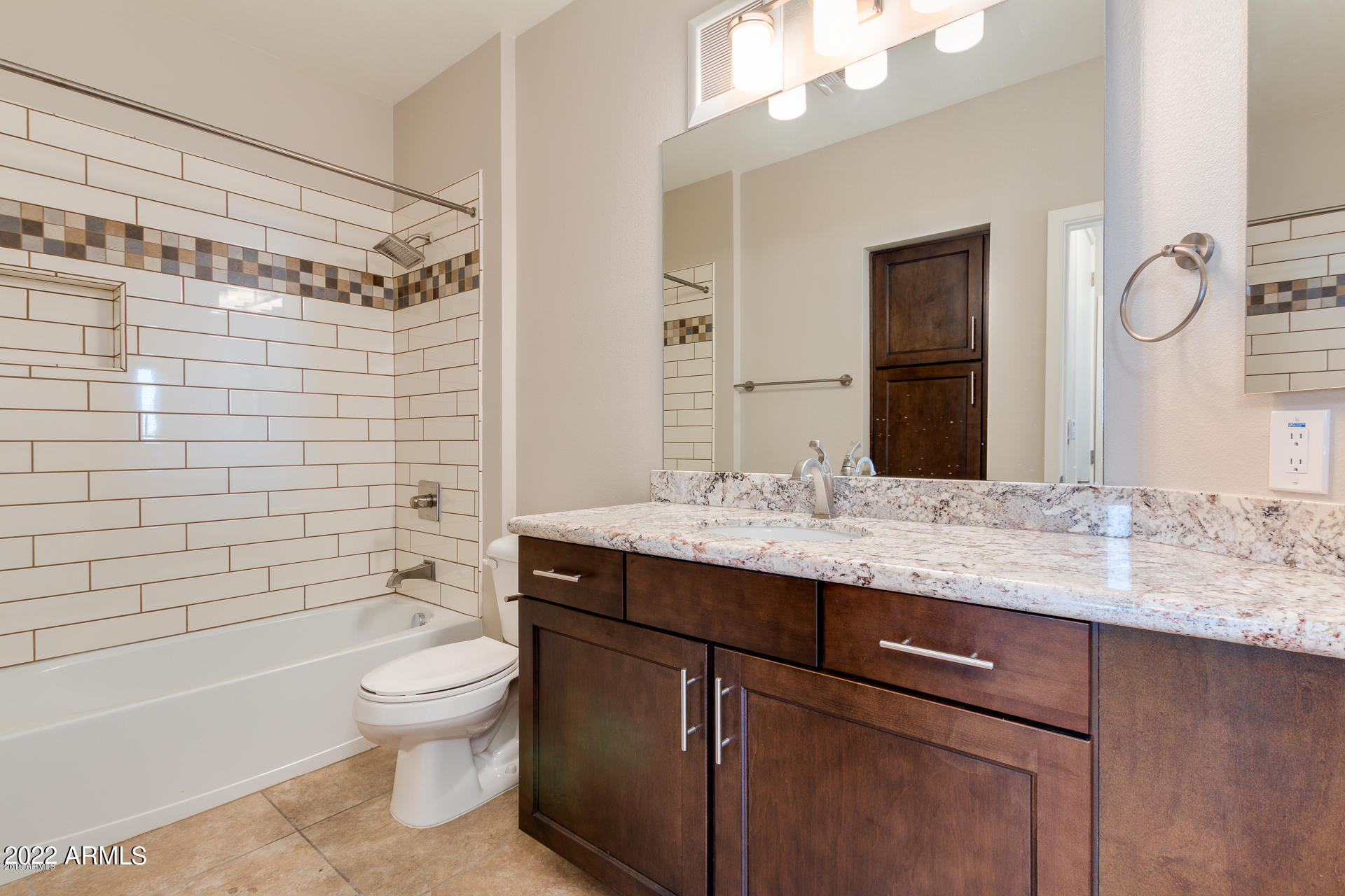 2511 West Queen Creek Road, Unit 238 Chandler, AZ 85248 - Photo 20 of 22 a bathroom with a granite countertop sink toilet mirror and shower