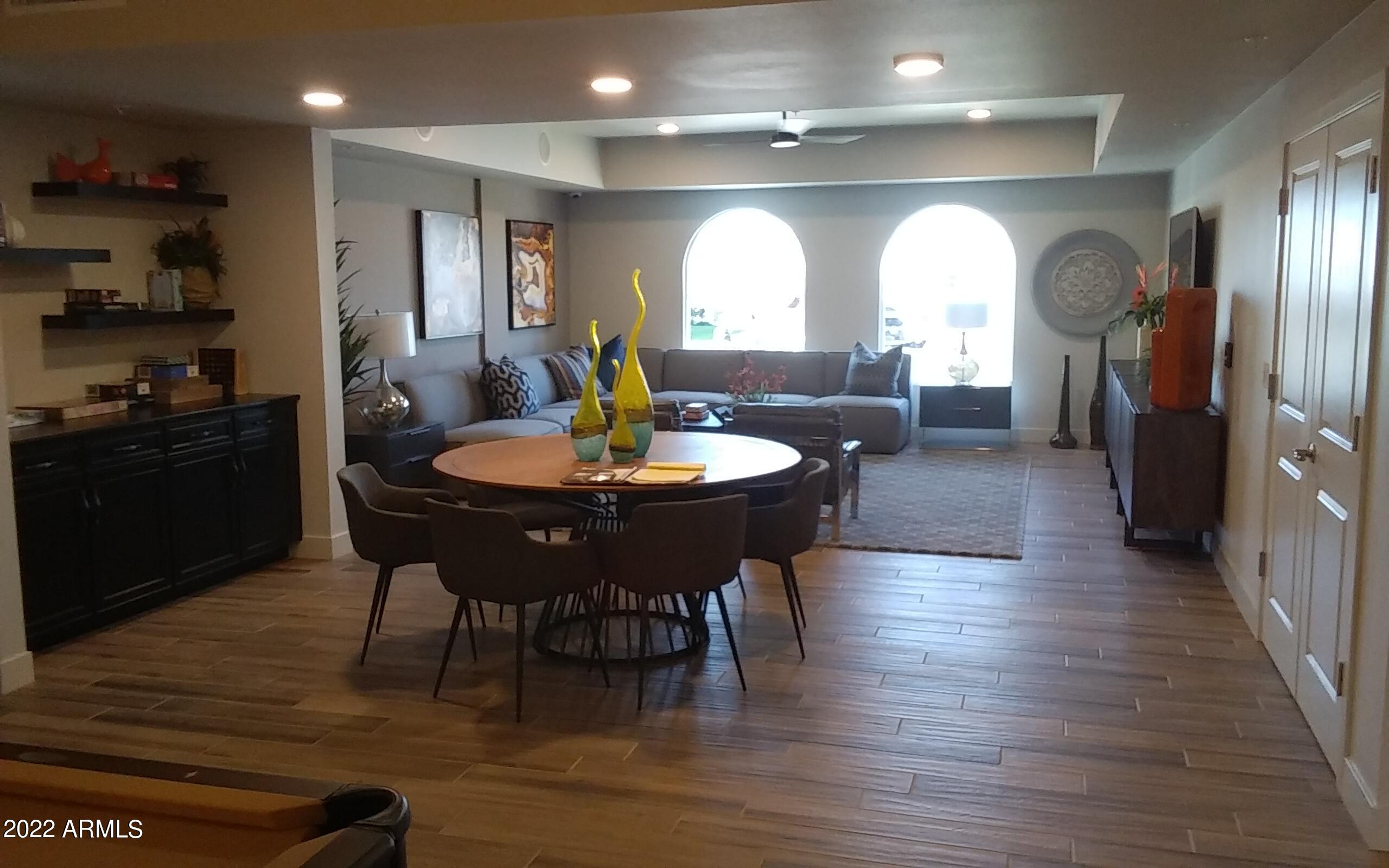 2511 West Queen Creek Road, Unit 238 Chandler, AZ 85248 - Photo 10 of 22 a view of a dining room with furniture