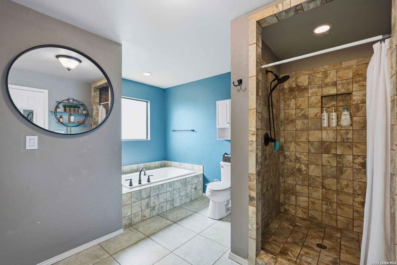202 Bryan Drive Jourdanton, TX 78026 - Photo 23 of 28 a bathroom with a sink and a mirror