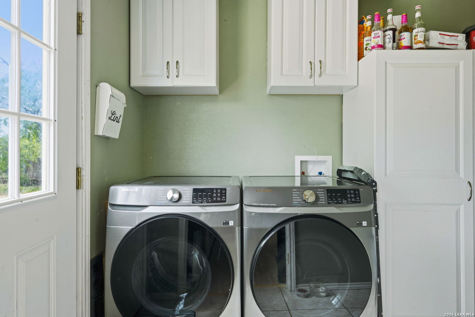 202 Bryan Drive Jourdanton, TX 78026 - Photo 24 of 28 a utility room with dryer and washer