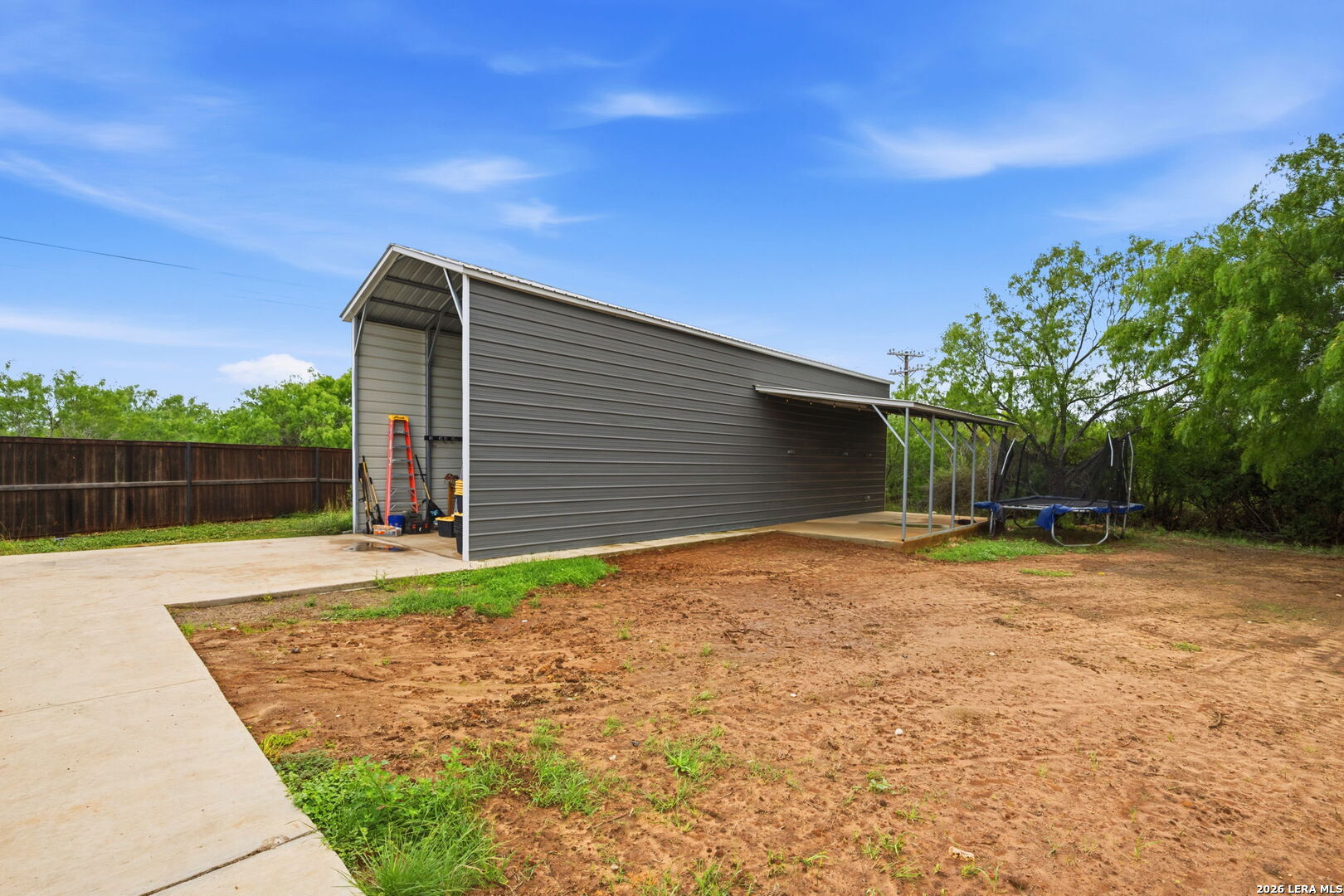 202 Bryan Drive Jourdanton, TX 78026 - Photo 27 of 28 a backyard of a house with lots of green space