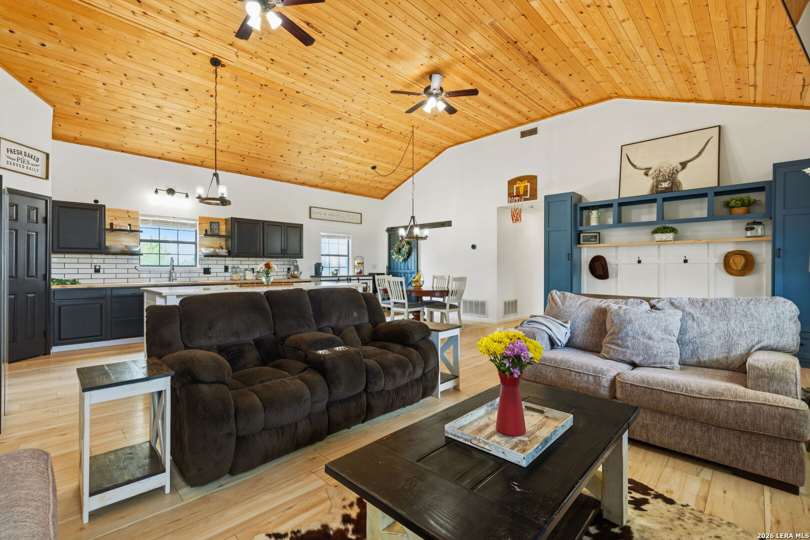 202 Bryan Drive Jourdanton, TX 78026 - Photo 8 of 28 a living room with furniture and kitchen view
