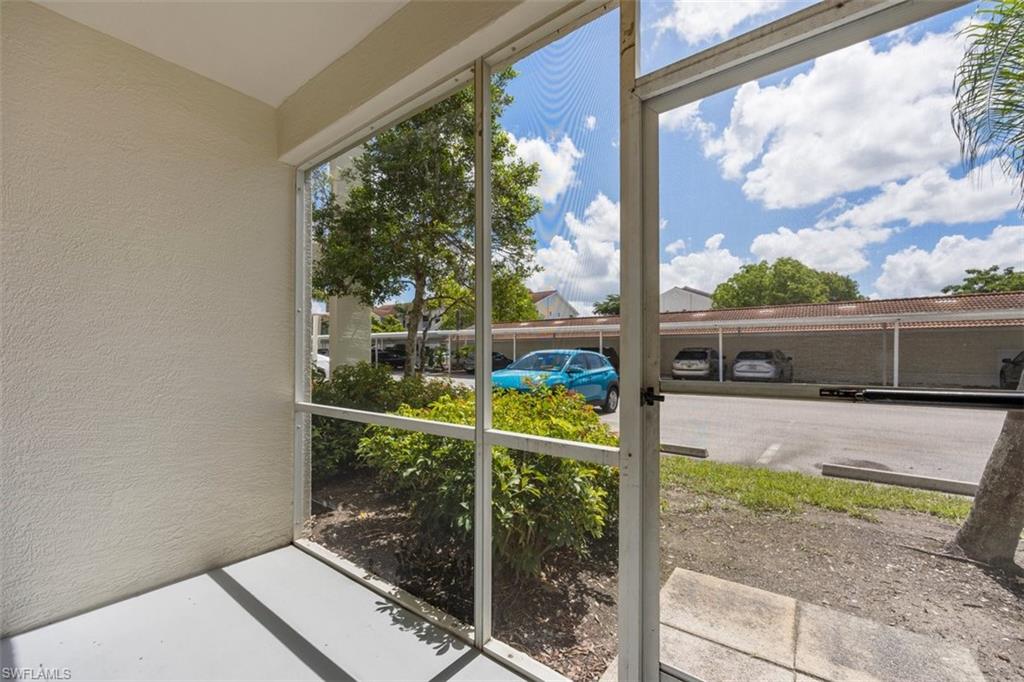 4635 St Croix Lane, Unit 1218 Naples, FL 34109 - Photo 22 of 40 View of unfurnished sunroom