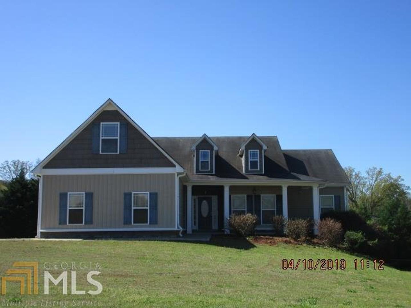 208 Point Ridge Court Temple, GA 30179 - Photo 1 of 1 a front view of a house with garden