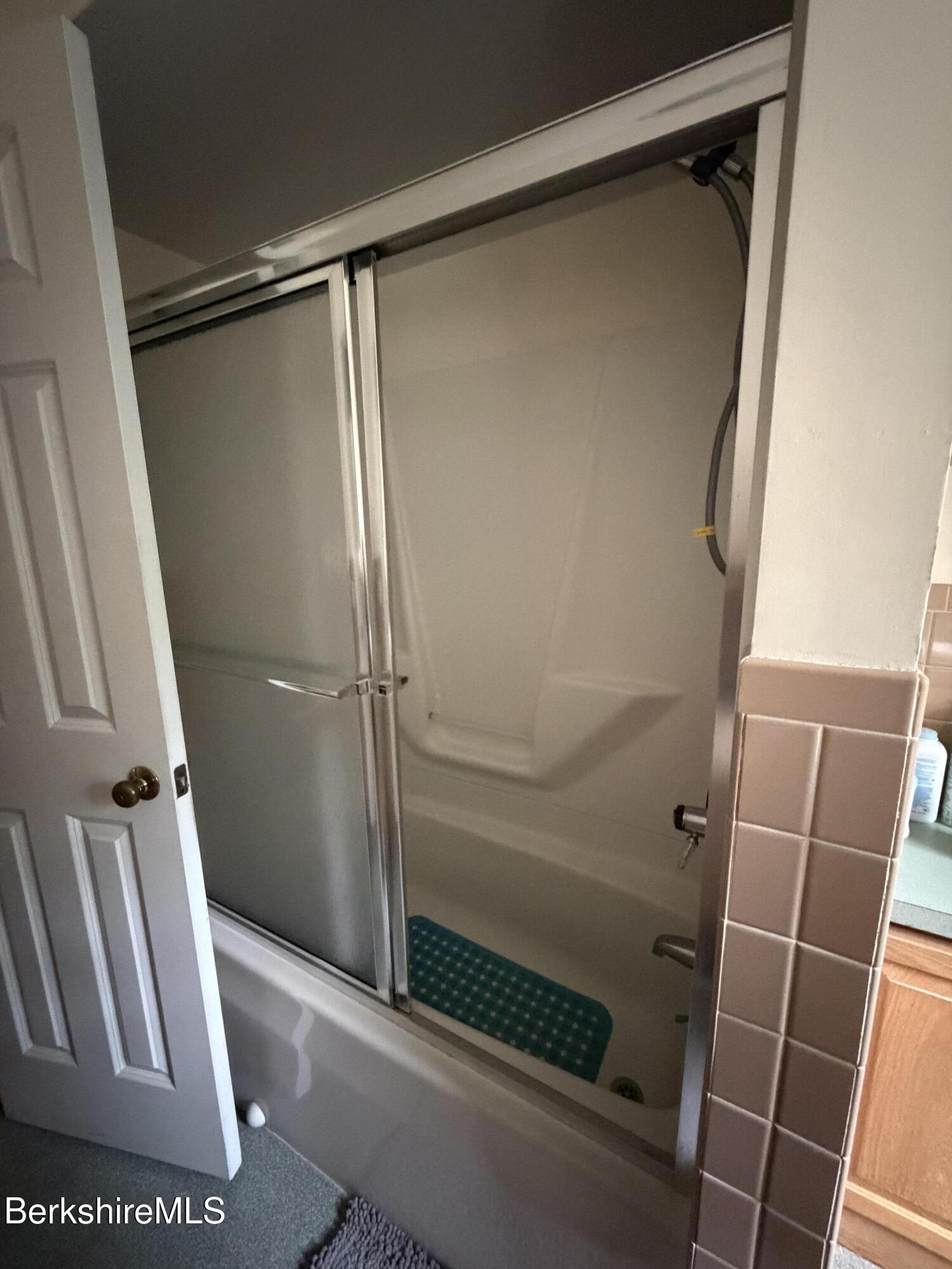 20 Sullivan Lane Lenox, MA 01240 - Photo 8 of 23 a bathroom with a glass shower door