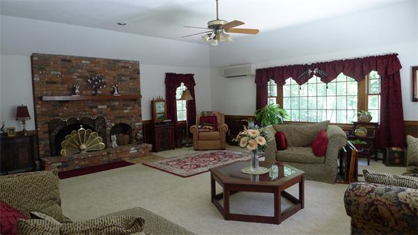 20 Willow Road Boxford, MA 01921 - Photo 8 of 15 a living room with furniture a rug and a large window