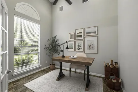 a workspace with furniture and a window