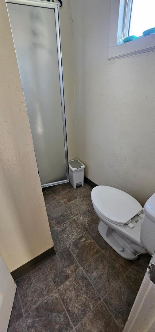 140 East Riverside Drive Watsonville, CA 95076 - Photo 23 of 49 a bathroom with a toilet and a shower