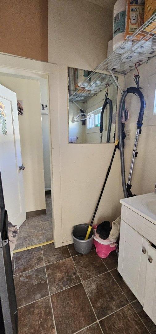 140 East Riverside Drive Watsonville, CA 95076 - Photo 30 of 49 a bathroom with a sink and mirror
