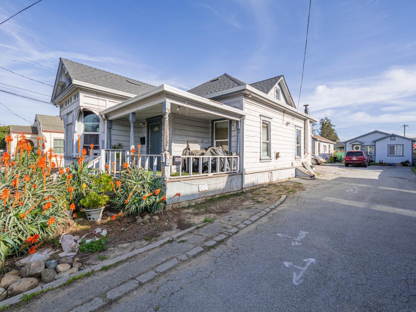 140 East Riverside Drive Watsonville, CA 95076 - Photo 3 of 49 a view of a house with a small yard and potted plants