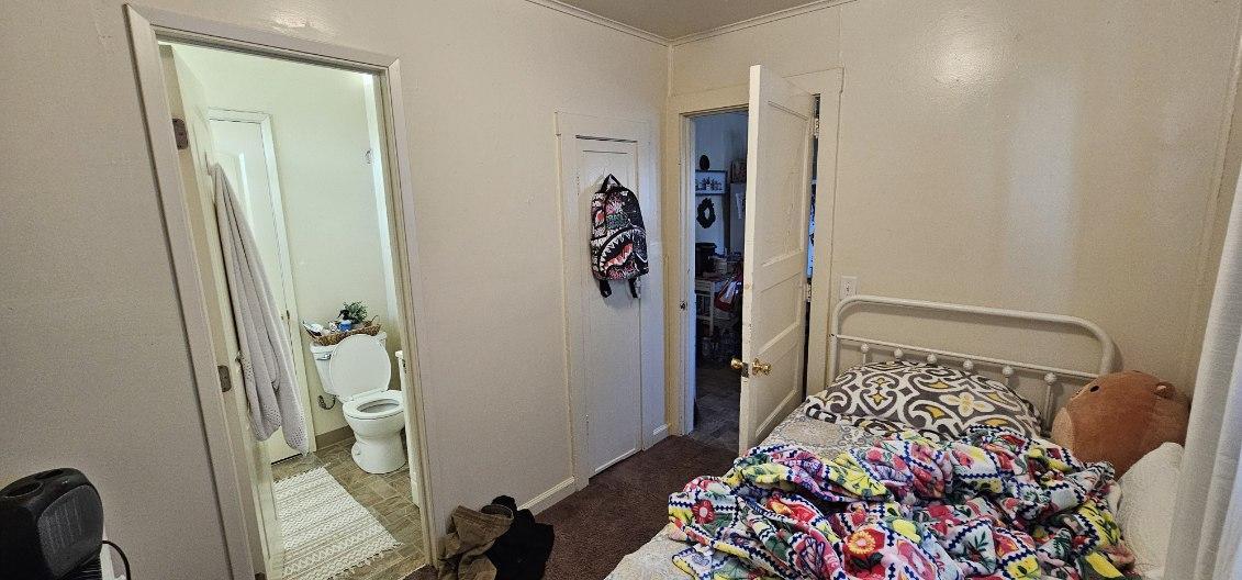 140 East Riverside Drive Watsonville, CA 95076 - Photo 39 of 49 a bedroom with a bed and a rug