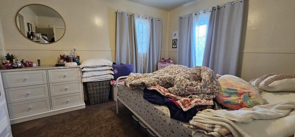 140 East Riverside Drive Watsonville, CA 95076 - Photo 44 of 49 a bedroom with bed and a mirror