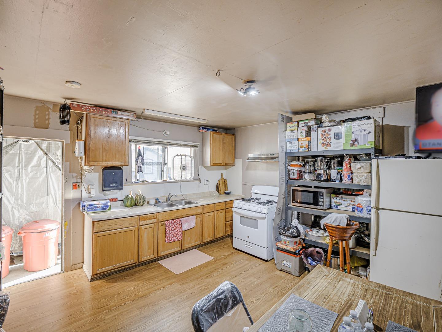 140 East Riverside Drive Watsonville, CA 95076 - Photo 6 of 49 a kitchen with cabinets and wooden floor