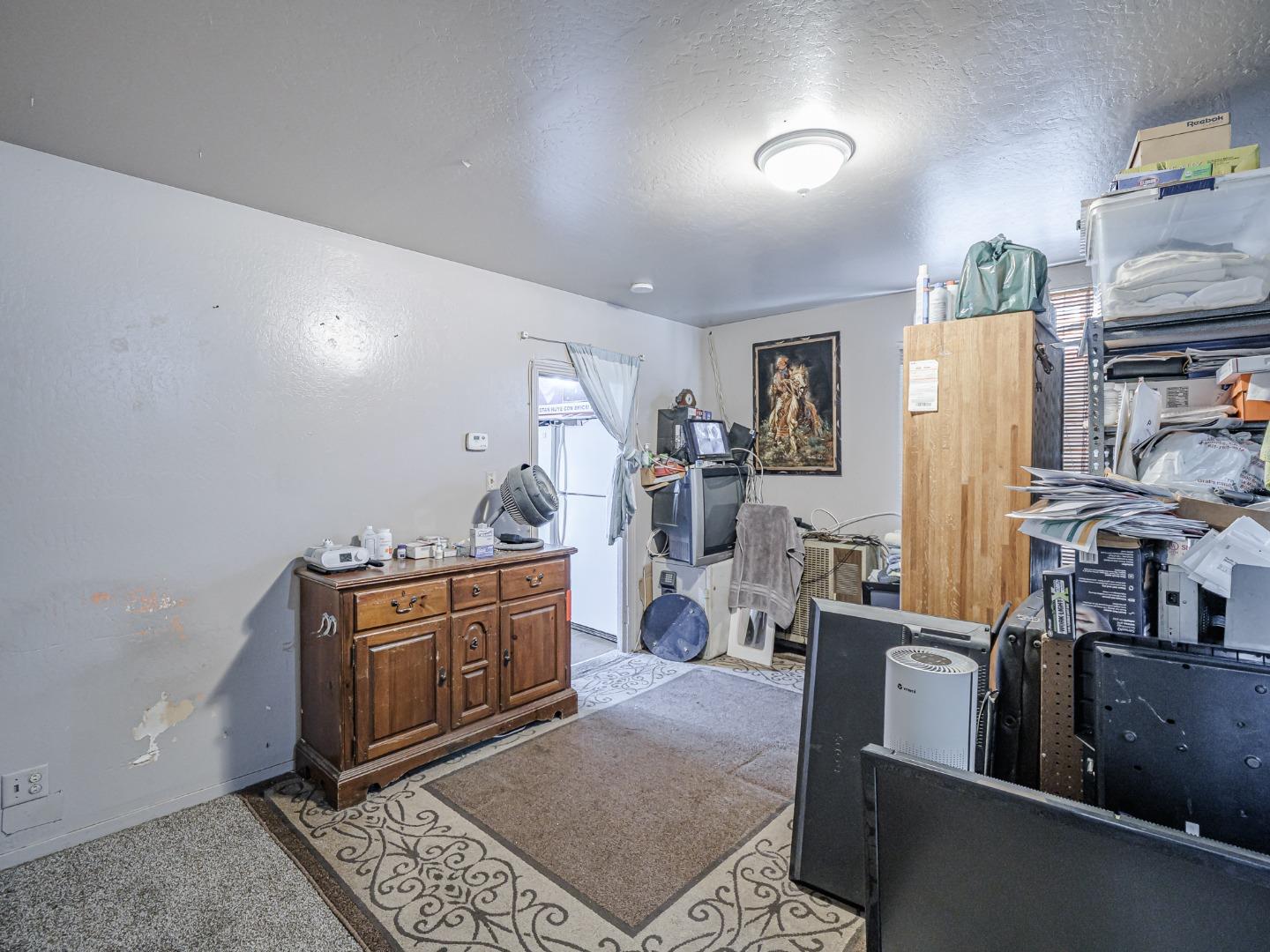 140 East Riverside Drive Watsonville, CA 95076 - Photo 7 of 49 a room with stainless steel appliances kitchen island granite countertop a refrigerator a stove a sink a dining table and chairs with wooden floor
