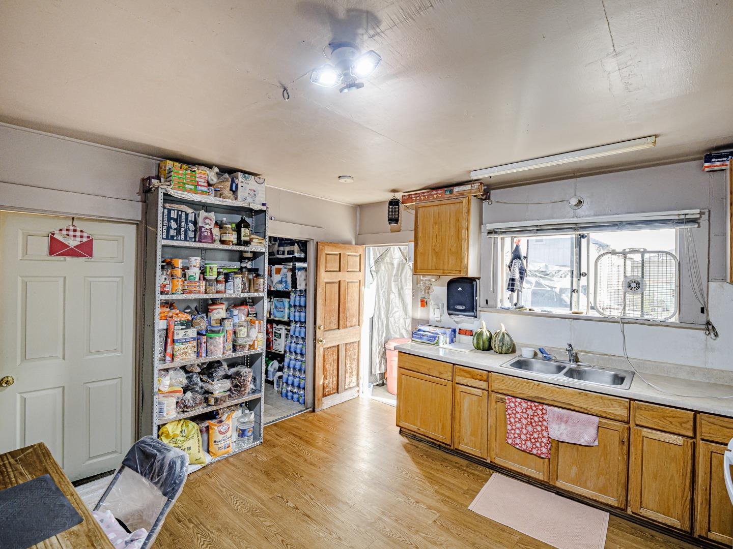 140 East Riverside Drive Watsonville, CA 95076 - Photo 9 of 49 a large living room with stainless steel appliances wooden floor and large window