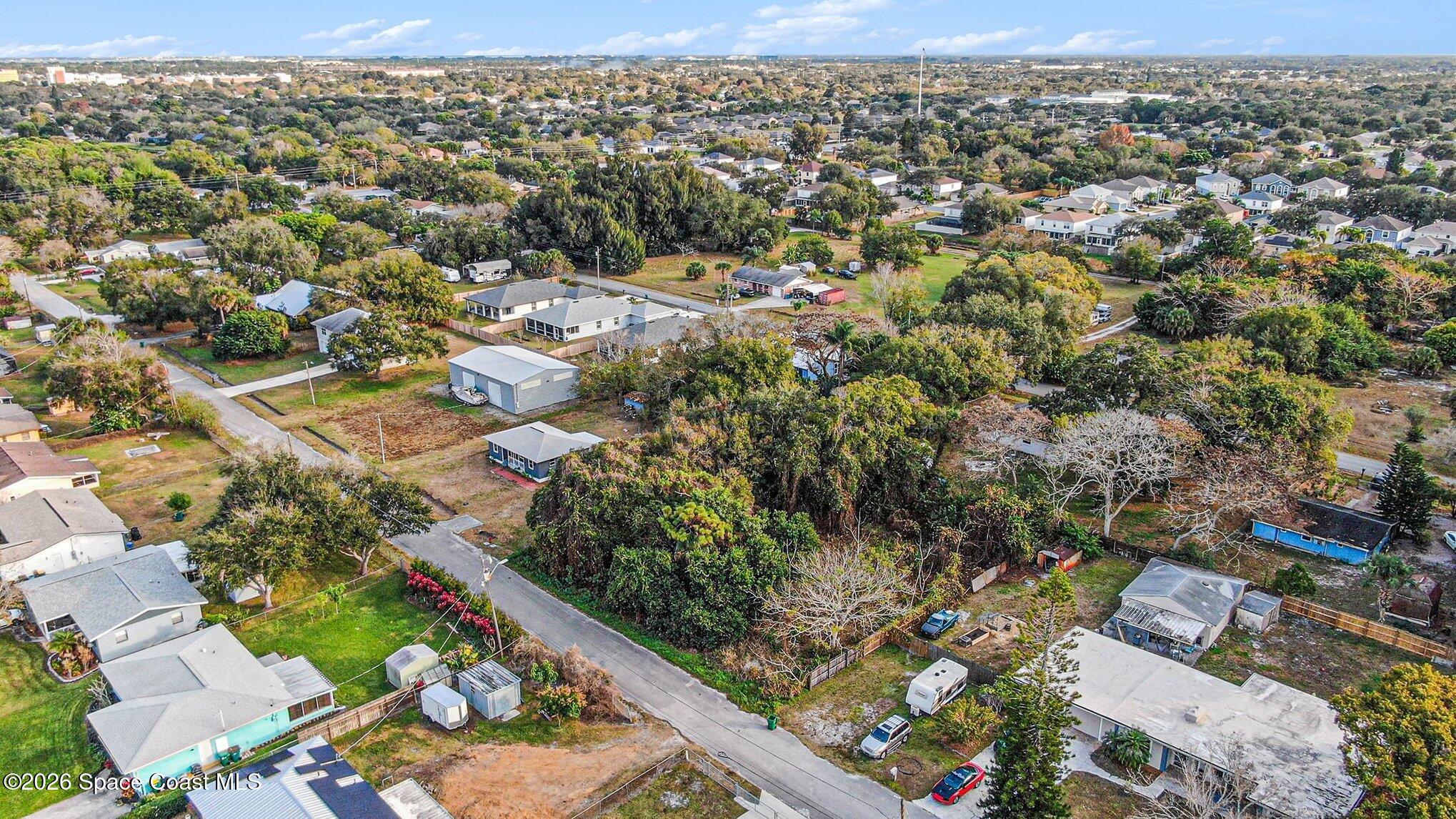 0 Unknown Street Melbourne, FL 32904 - Photo 15 of 16 an aerial view of residential houses with outdoor space