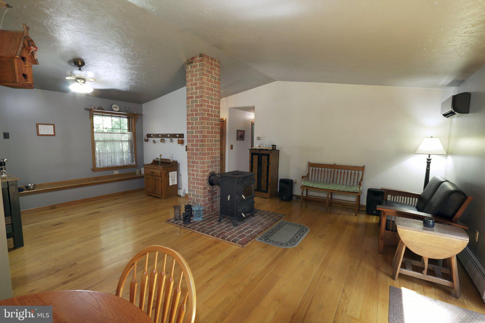 1580 Girl Scout Road Denver, PA 17517 - Photo 17 of 47 Bright and open living area with coal stove
