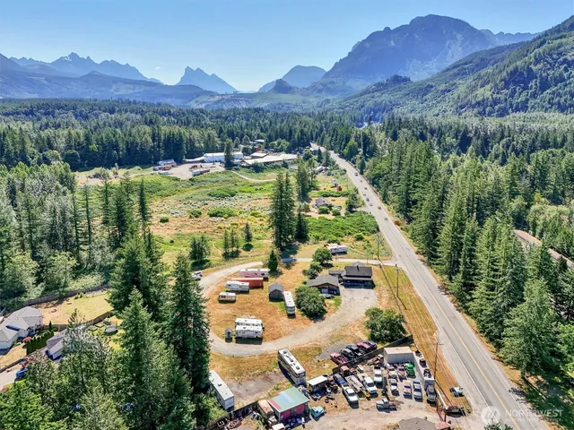 a view of a patio with furniture and a yard