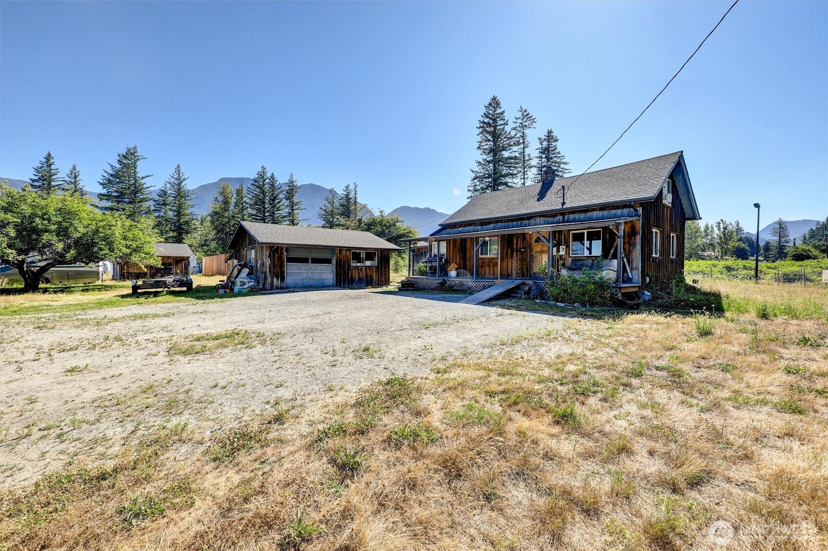41109 State Rte 2 Gold Bar, WA 98251 - Photo 6 of 22 a front view of a house with a yard