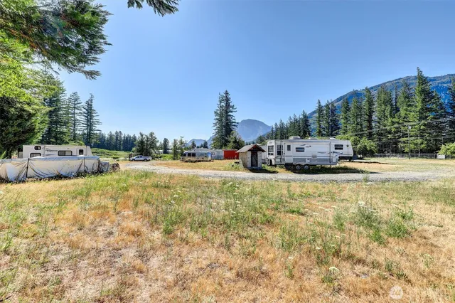 a swimming pool with trees in the background