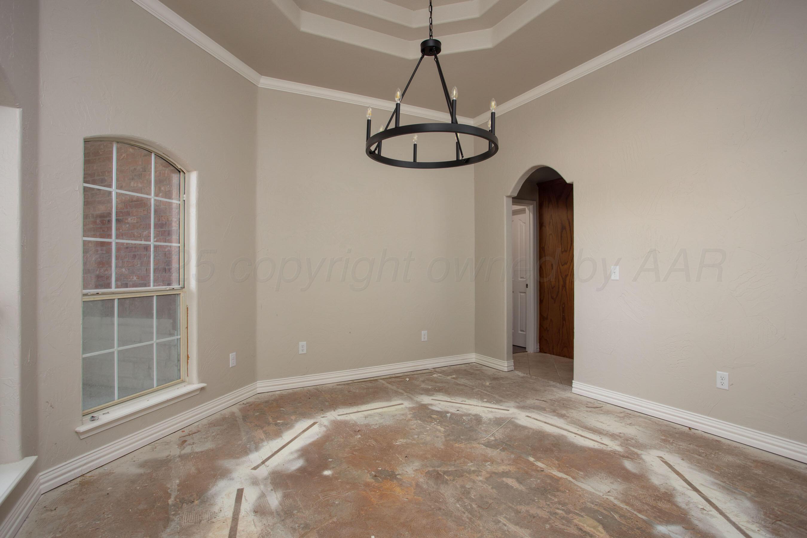 9050 Greyhawk Road Amarillo, TX 79119 - Photo 12 of 55 a view of an empty room with windows