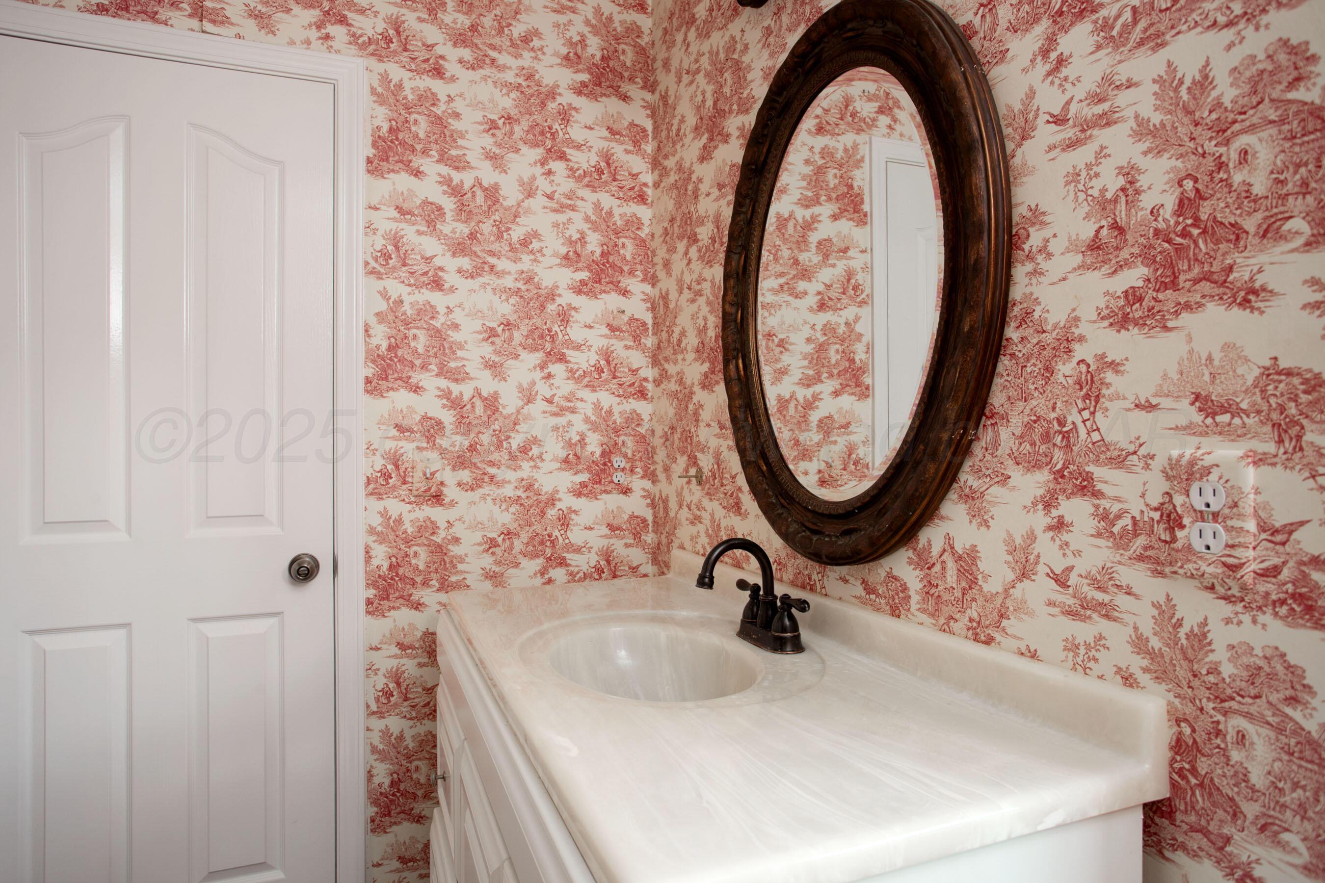 9050 Greyhawk Road Amarillo, TX 79119 - Photo 34 of 55 a bathroom with a sink and a mirror