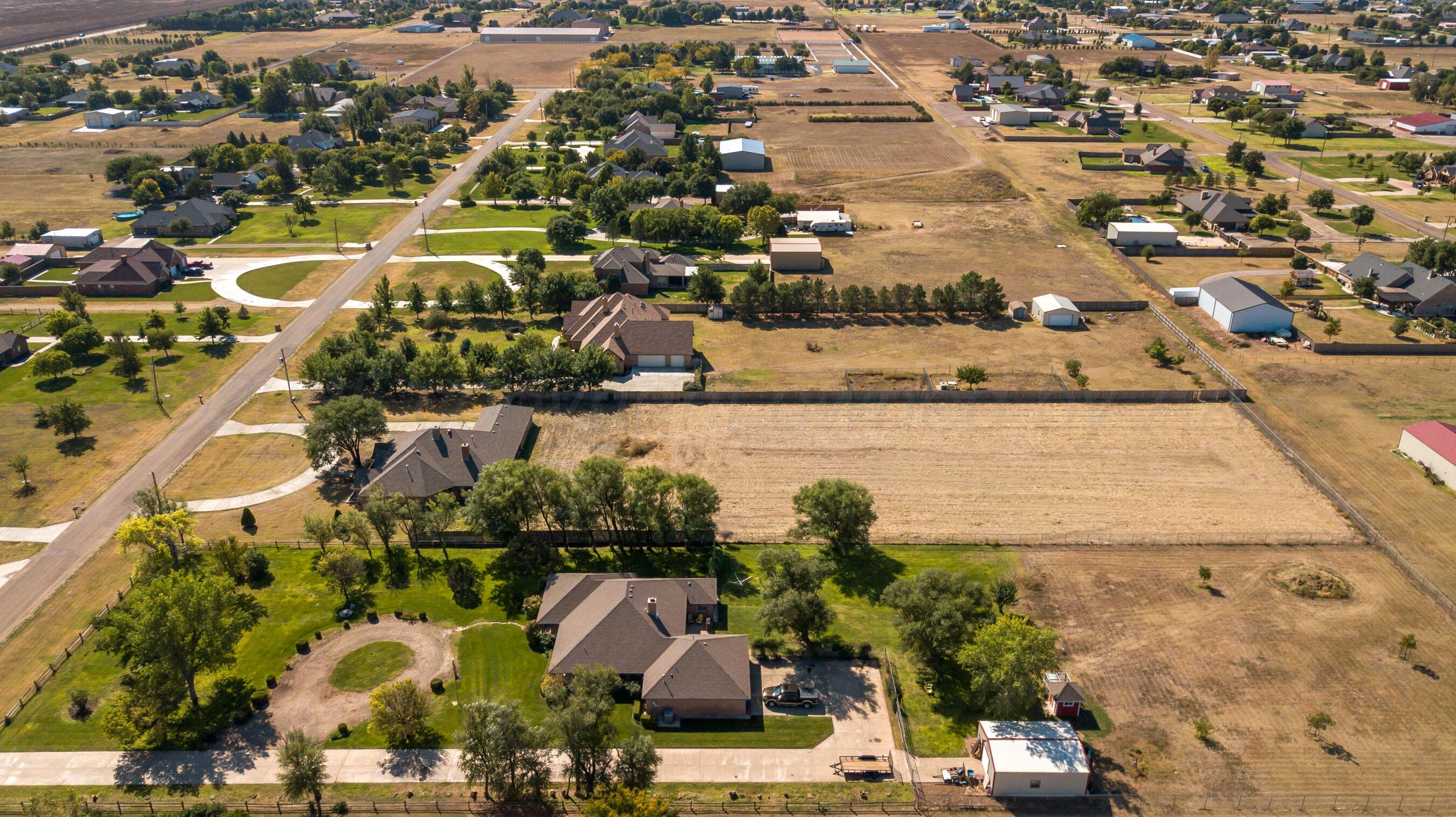 9050 Greyhawk Road Amarillo, TX 79119 - Photo 39 of 55 an aerial view of residential houses with outdoor space