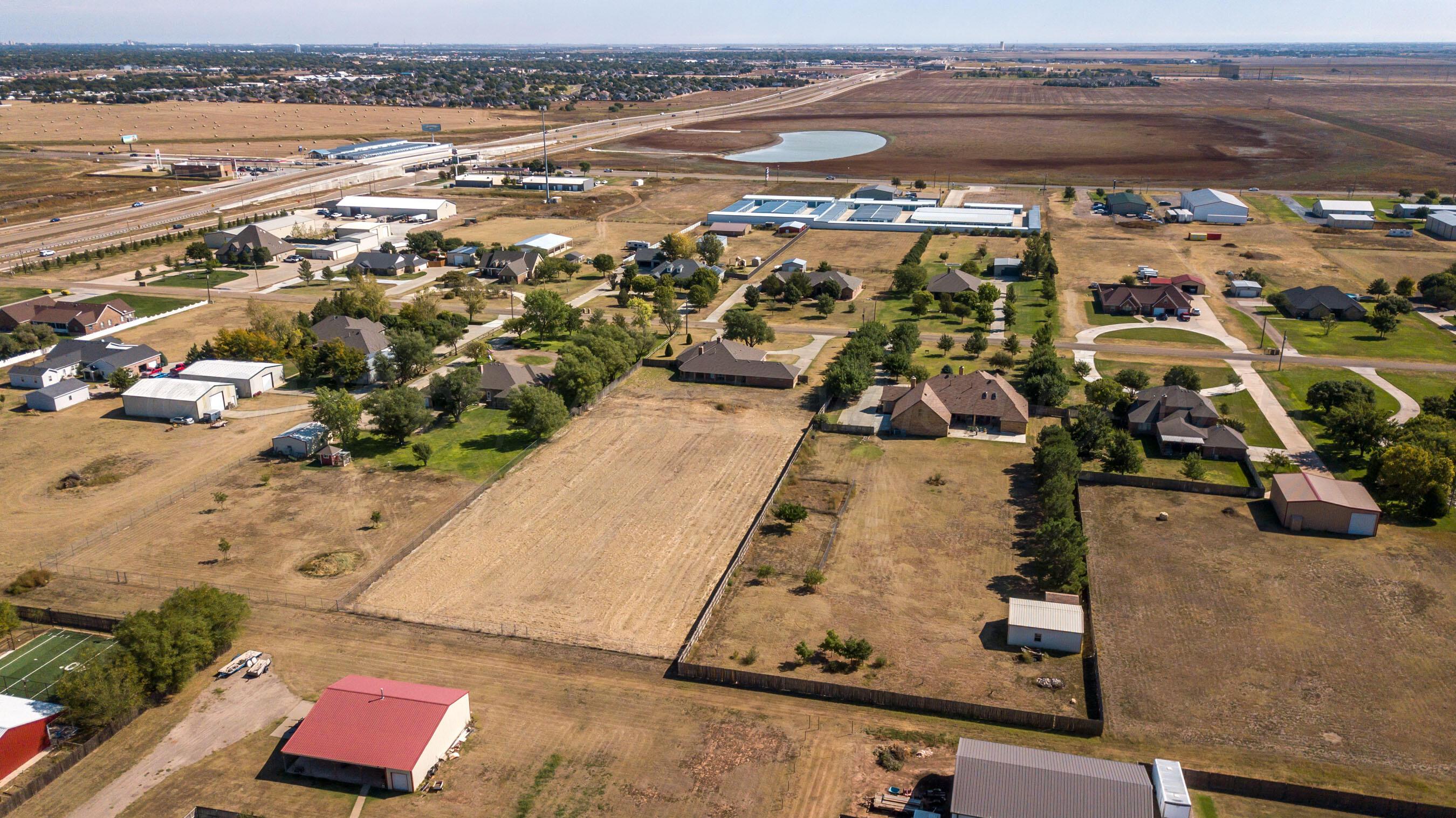 9050 Greyhawk Road Amarillo, TX 79119 - Photo 43 of 55 an aerial view of residential houses with outdoor space