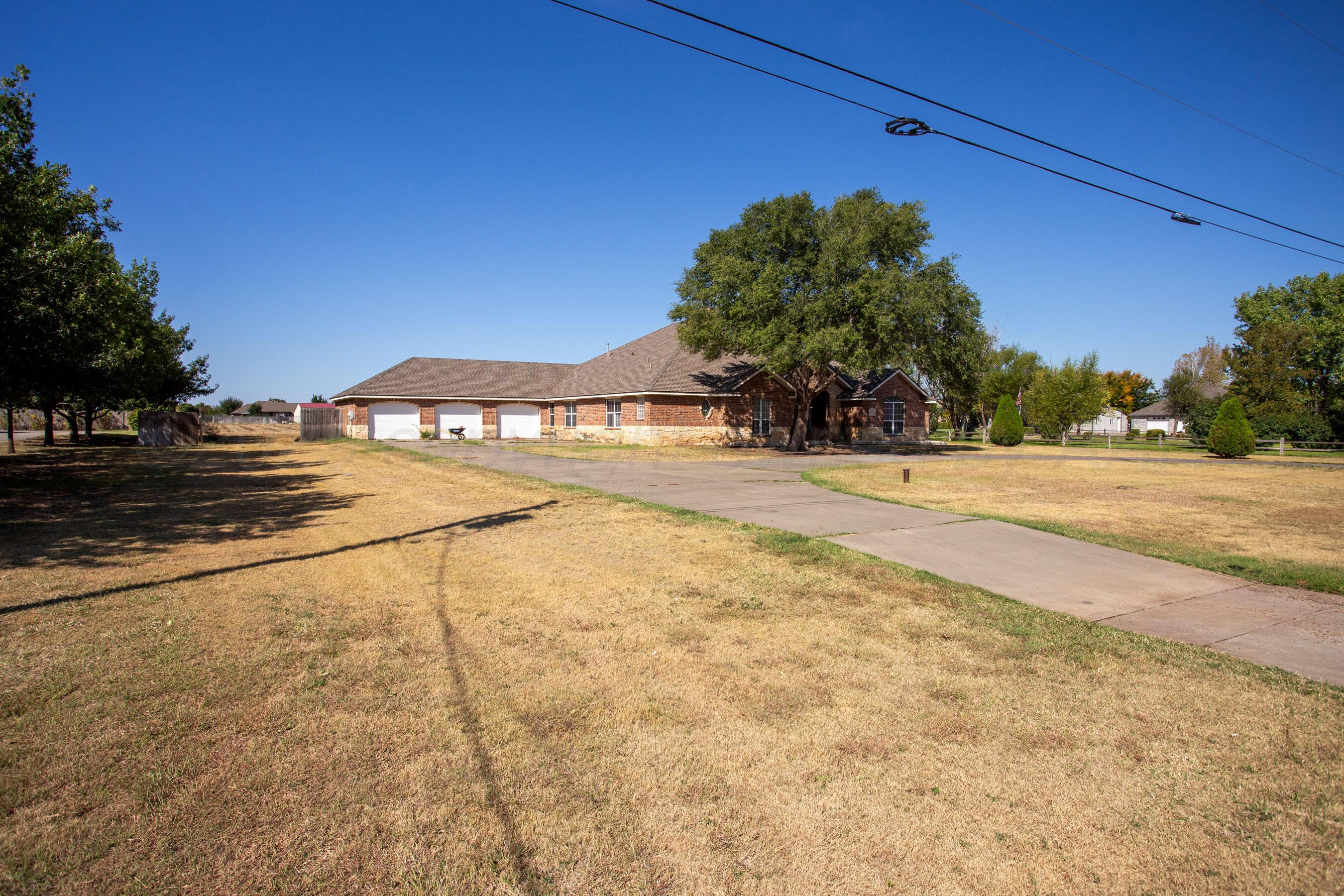 9050 Greyhawk Road Amarillo, TX 79119 - Photo 54 of 55 a view of a backyard of the house