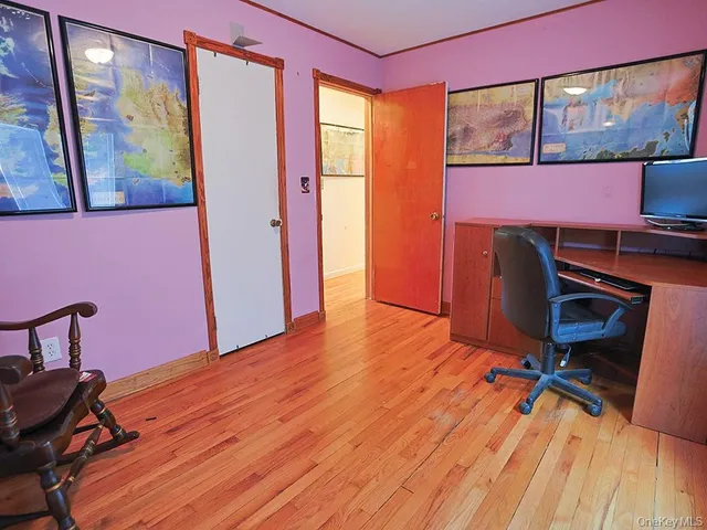 a workspace with furniture and window