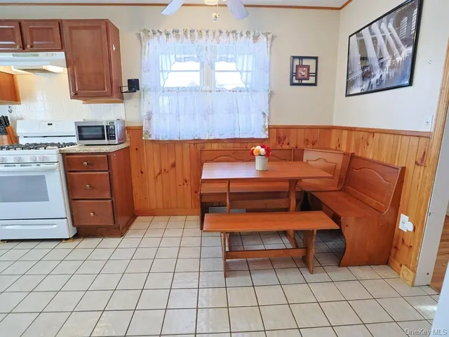 a living room with furniture and painting on the wall