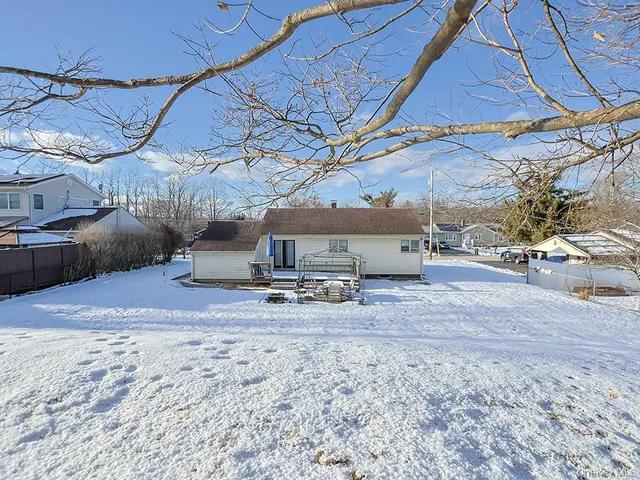 a wooden bench sitting in middle of a field