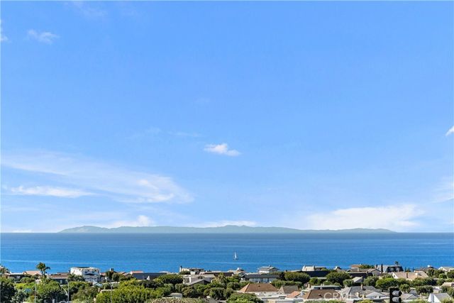 a view of a house with a yard porch and sitting area