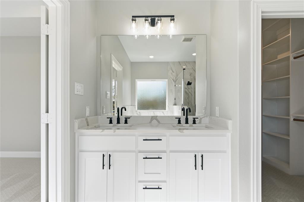 420 Ball Street Tom Bean, TX 75491 - Photo 15 of 34 a bathroom with a sink and a mirror