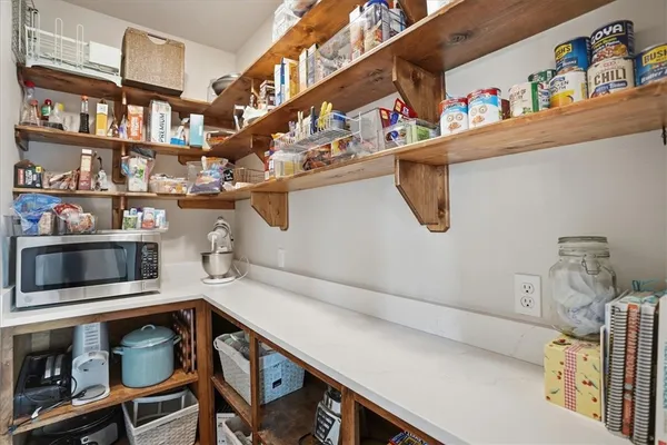 a bedroom with a bed and a chair