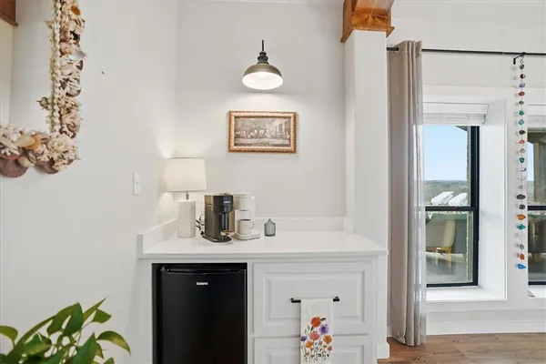 a bathroom with a double vanity sink a mirror a shower and a bathtub