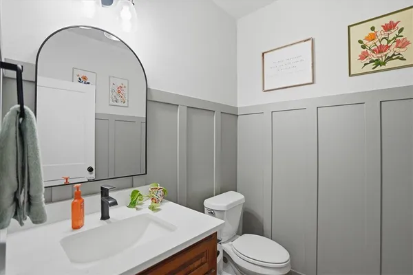 a spacious bathroom with a double vanity sink and a mirror