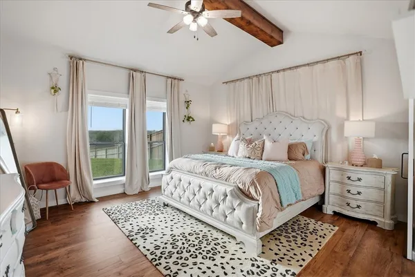 a bathroom with a granite countertop sink toilet and mirror