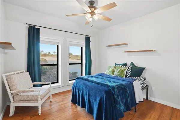 swimming pool view with a seating space