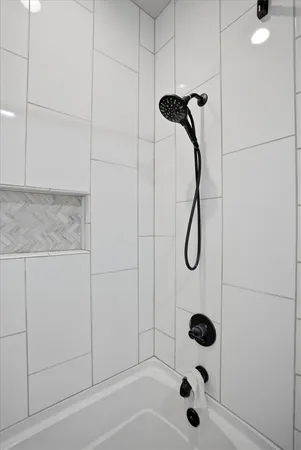 a view of a patio with a table and chairs