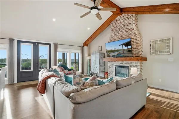 a living room with furniture and wooden floor