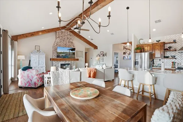 a kitchen with stainless steel appliances granite countertop a refrigerator and a stove