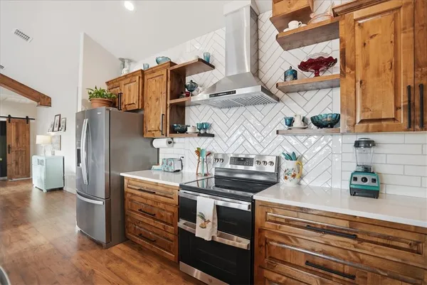 a bathroom with a sink a toilet and shower curtain