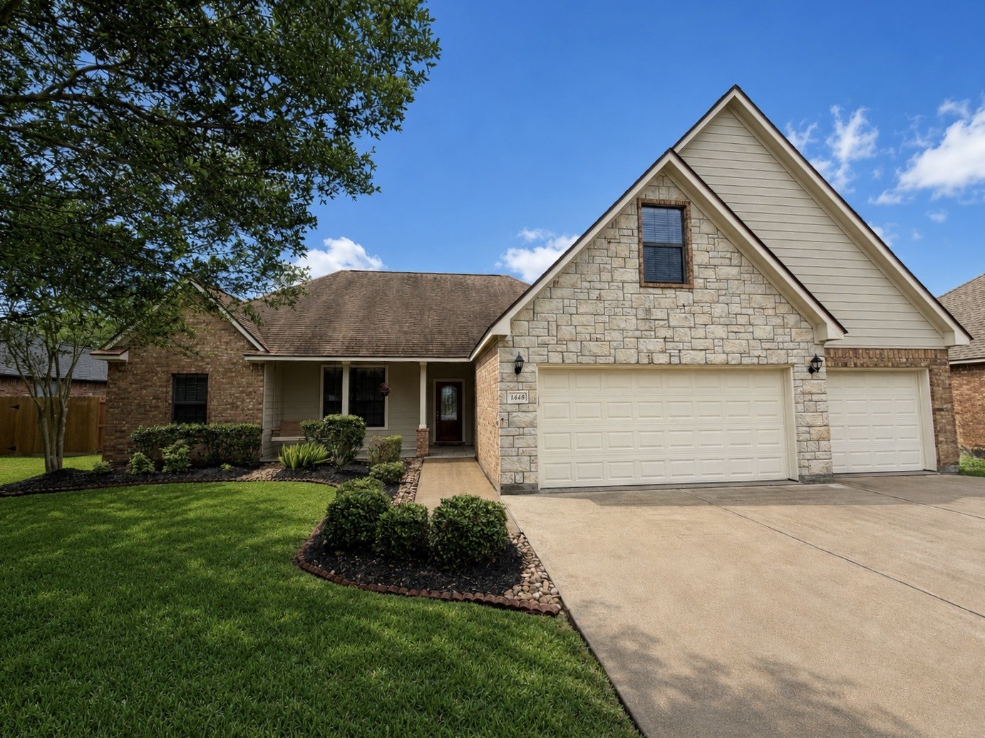 1448 South Blue Bonnet Lane Angleton, TX 77515 - Photo 43 of 43 a front view of house with yard and green space