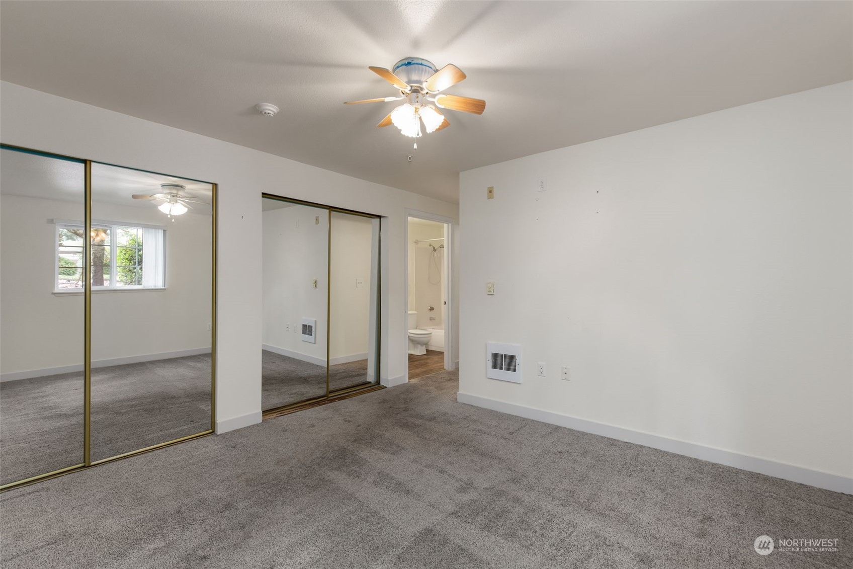 11002 Southeast Petrovitsky Road, Unit E101 Renton, WA 98055 - Photo 17 of 40 a view of an empty room with a window