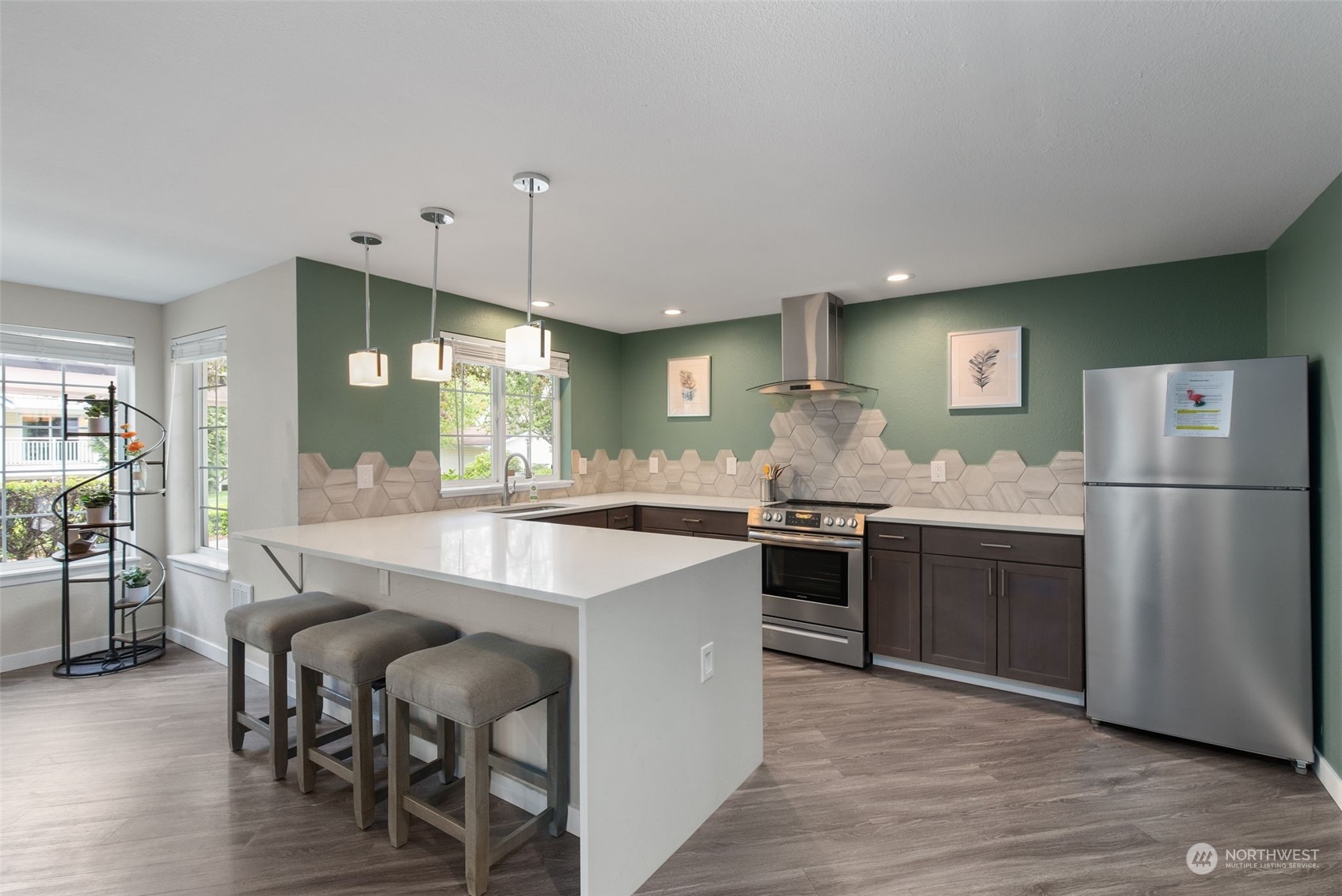 11002 Southeast Petrovitsky Road, Unit E101 Renton, WA 98055 - Photo 33 of 40 a large kitchen with a table and chairs